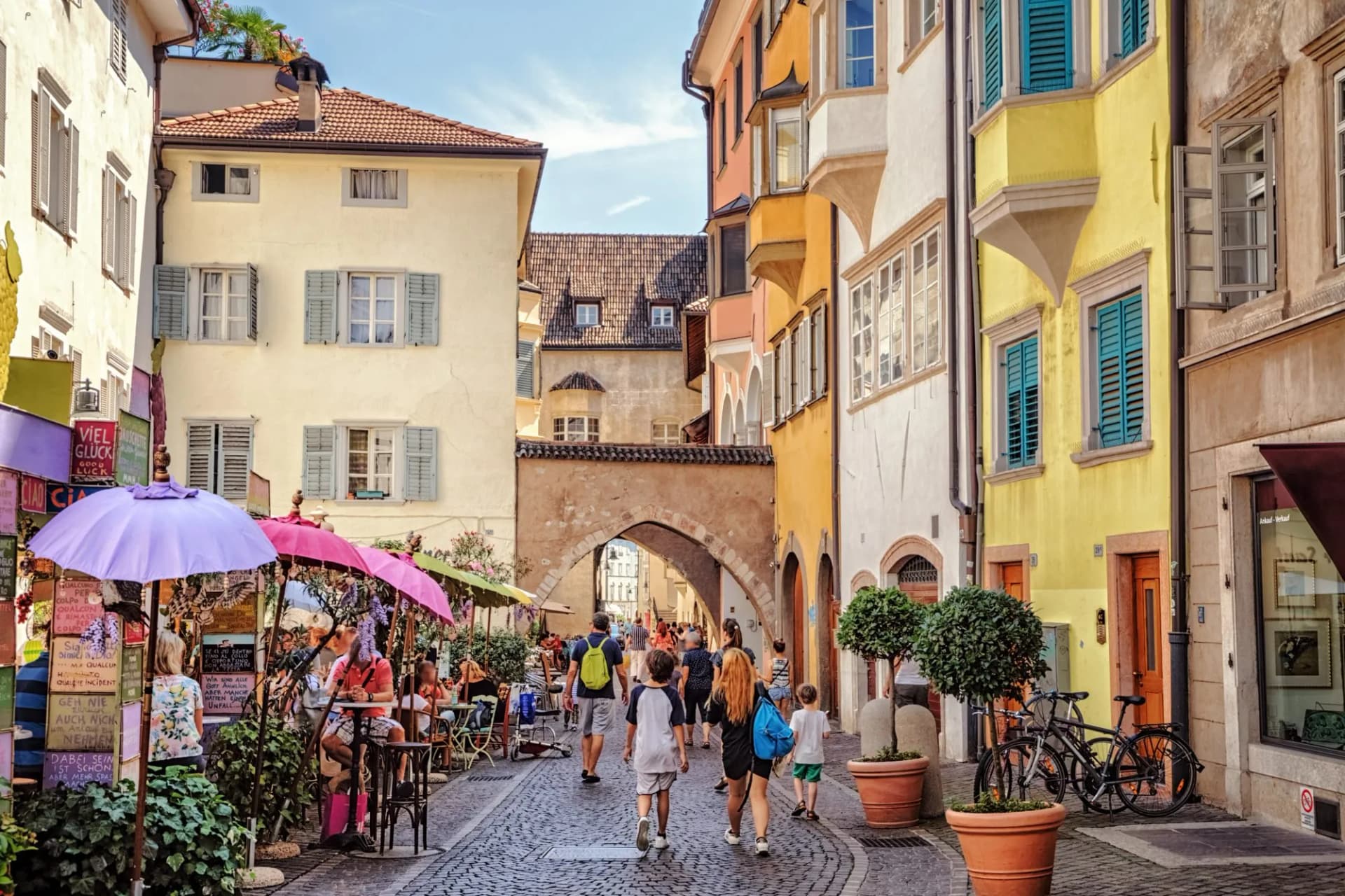 Tourists walking along via dr josef streiter in bolzano