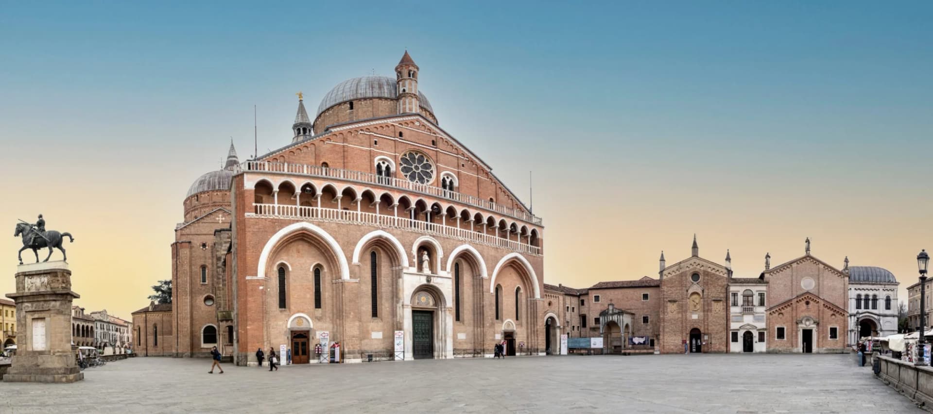 Basilica of Saint Anthony and equestrian statue in a large square in Padua.