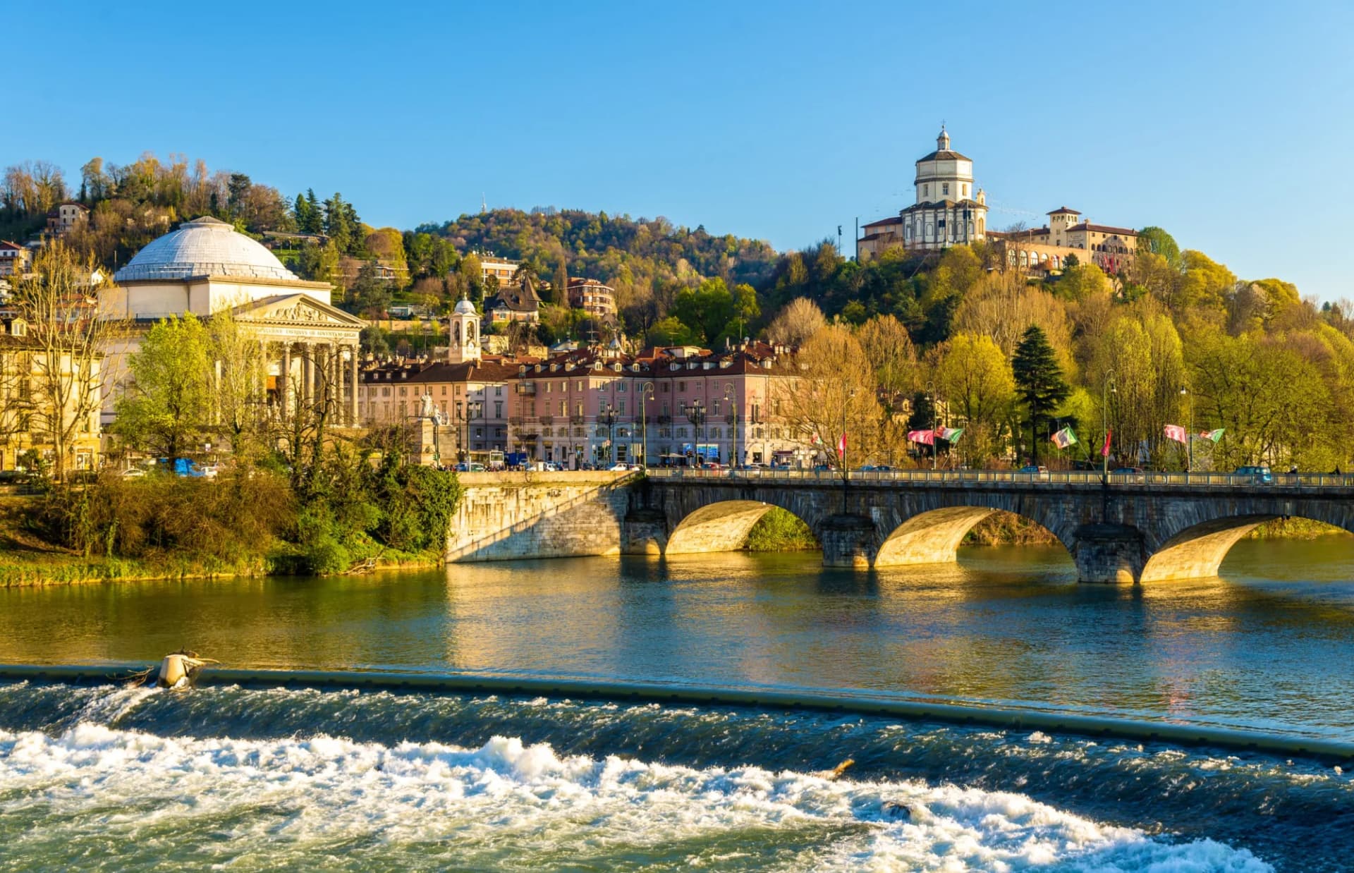 View of Turin over the Po River with the Superga Basilica on the hill.