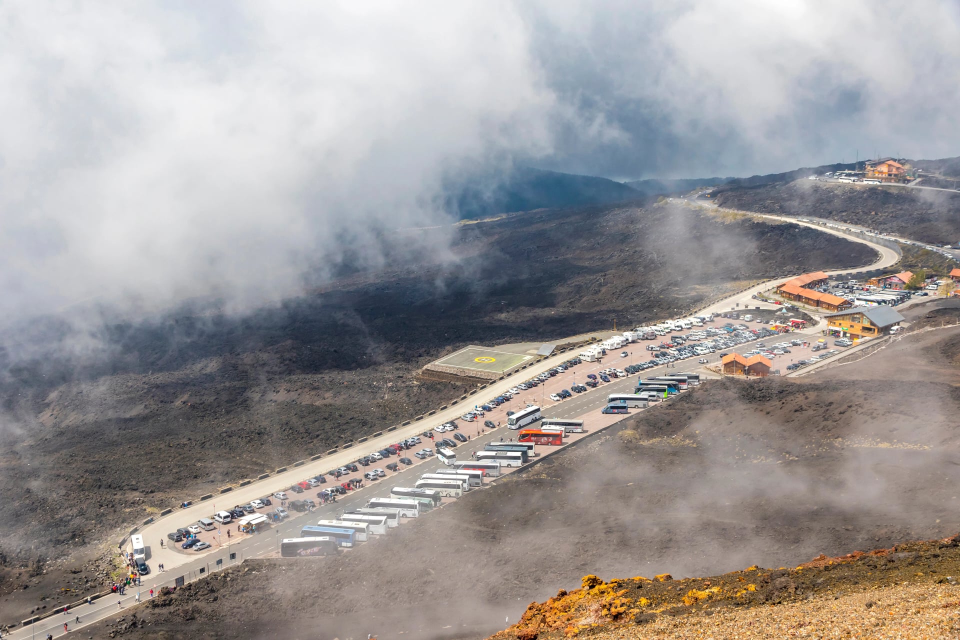 Rifugio Sapienza - tourists parking and base station on the foothills of Mount Etna, Etna national park, Sicily, Italy.