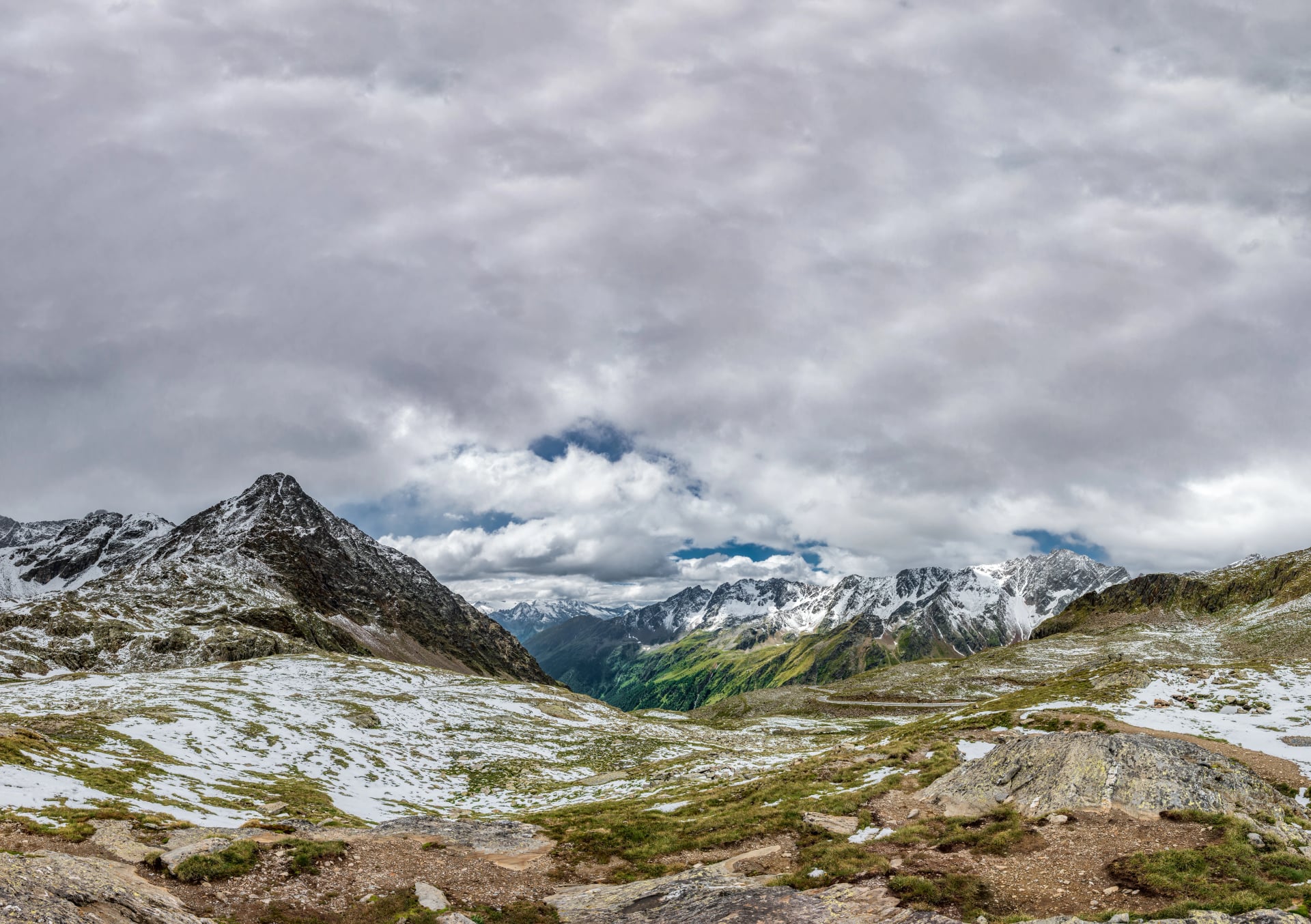 Top of Gavia Pass with snow covered mountains