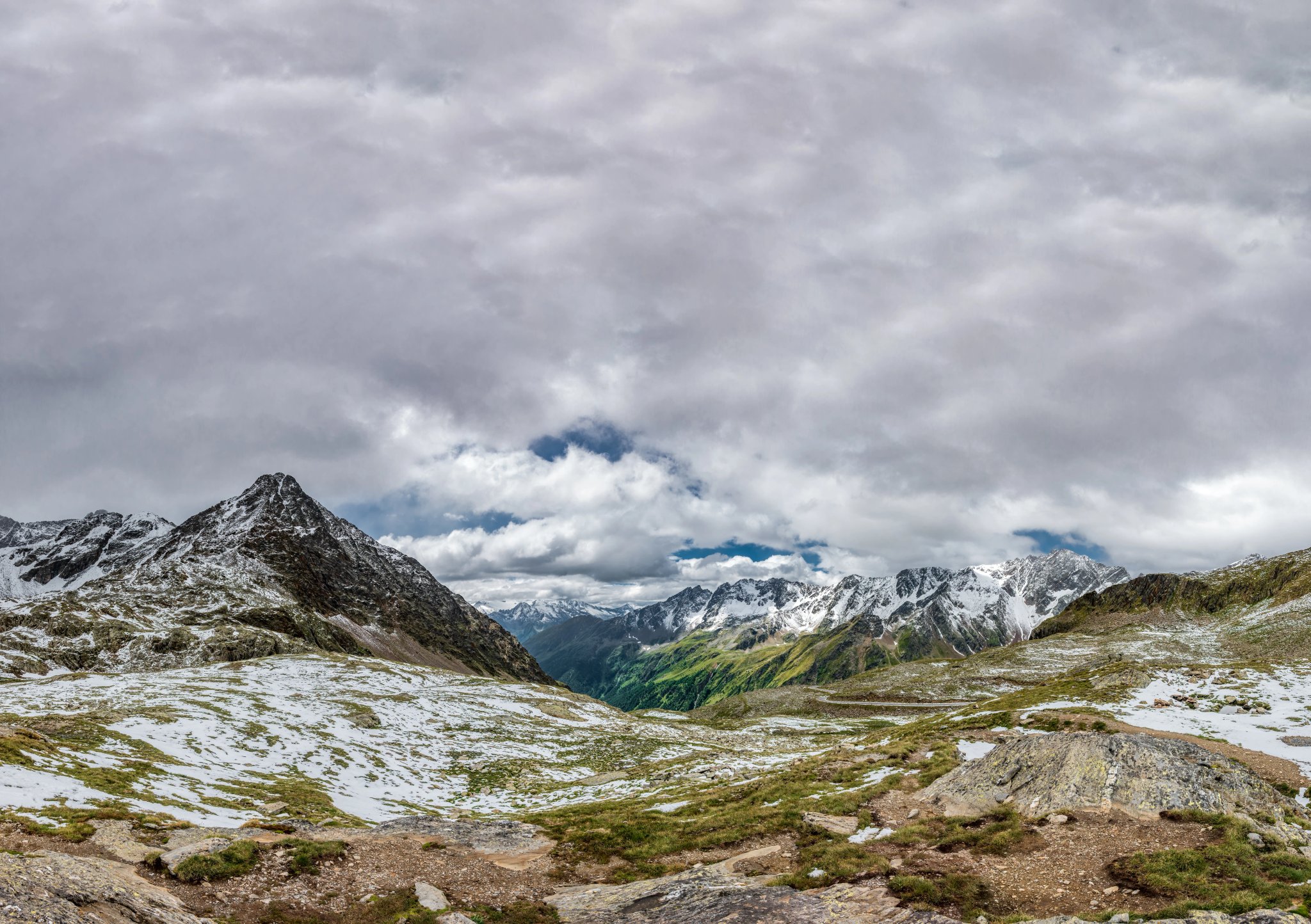 Top of Gavia Pass with snow covered mountains